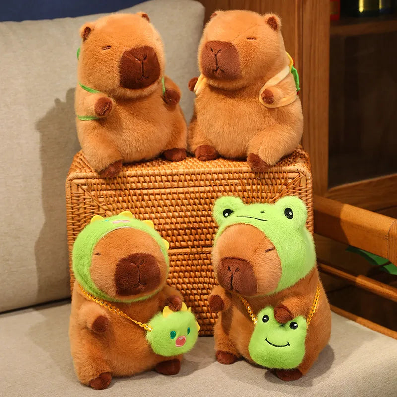 Four kawaii plush toys resembling animals on a woven box with a neutral background