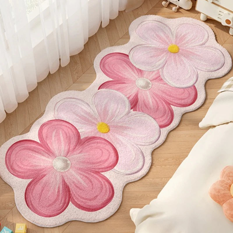 Floral-shaped kawaii rug with pink flowers on a wooden floor.