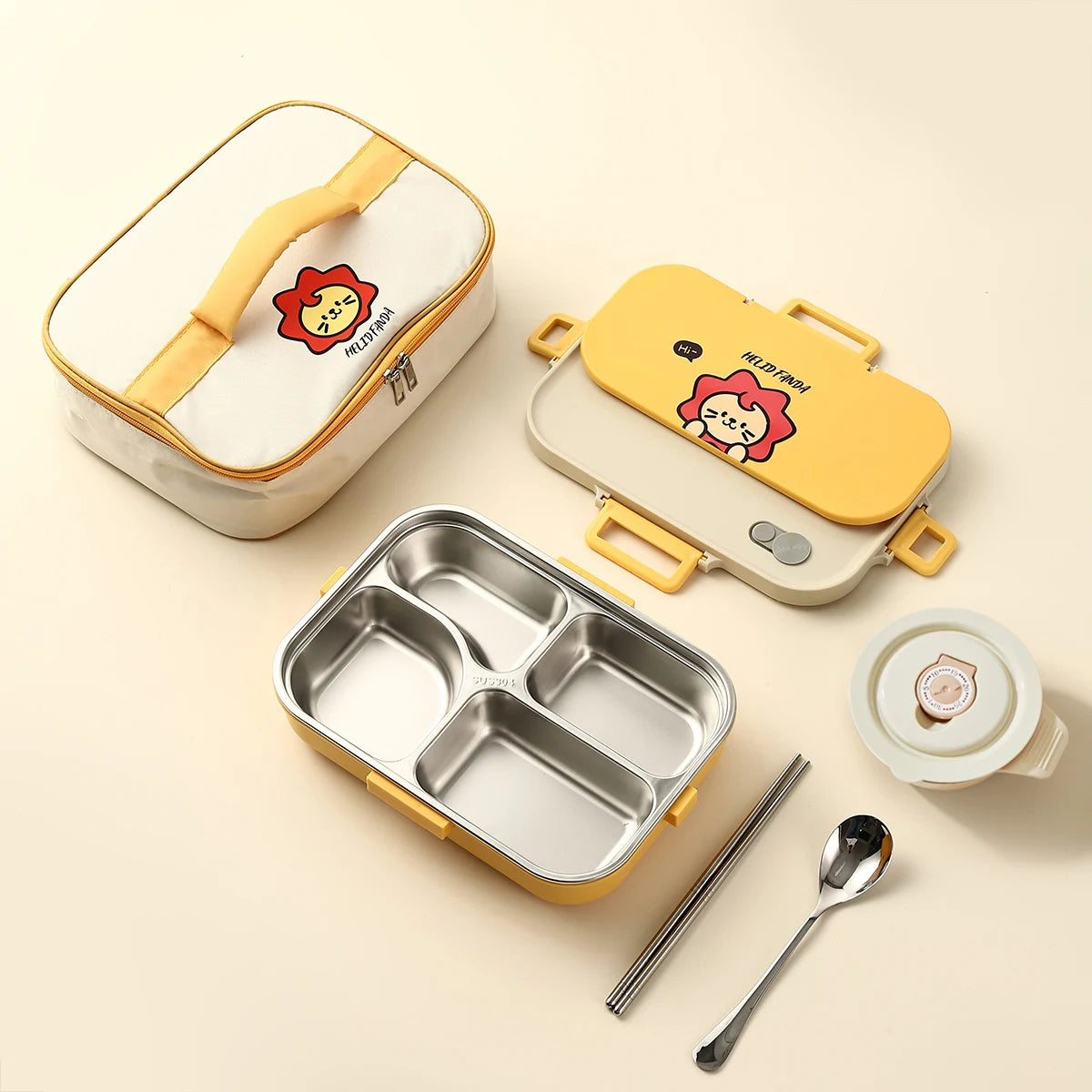 Kawaii lunch box set with compartments, lid, spoon, and chopsticks on a beige background