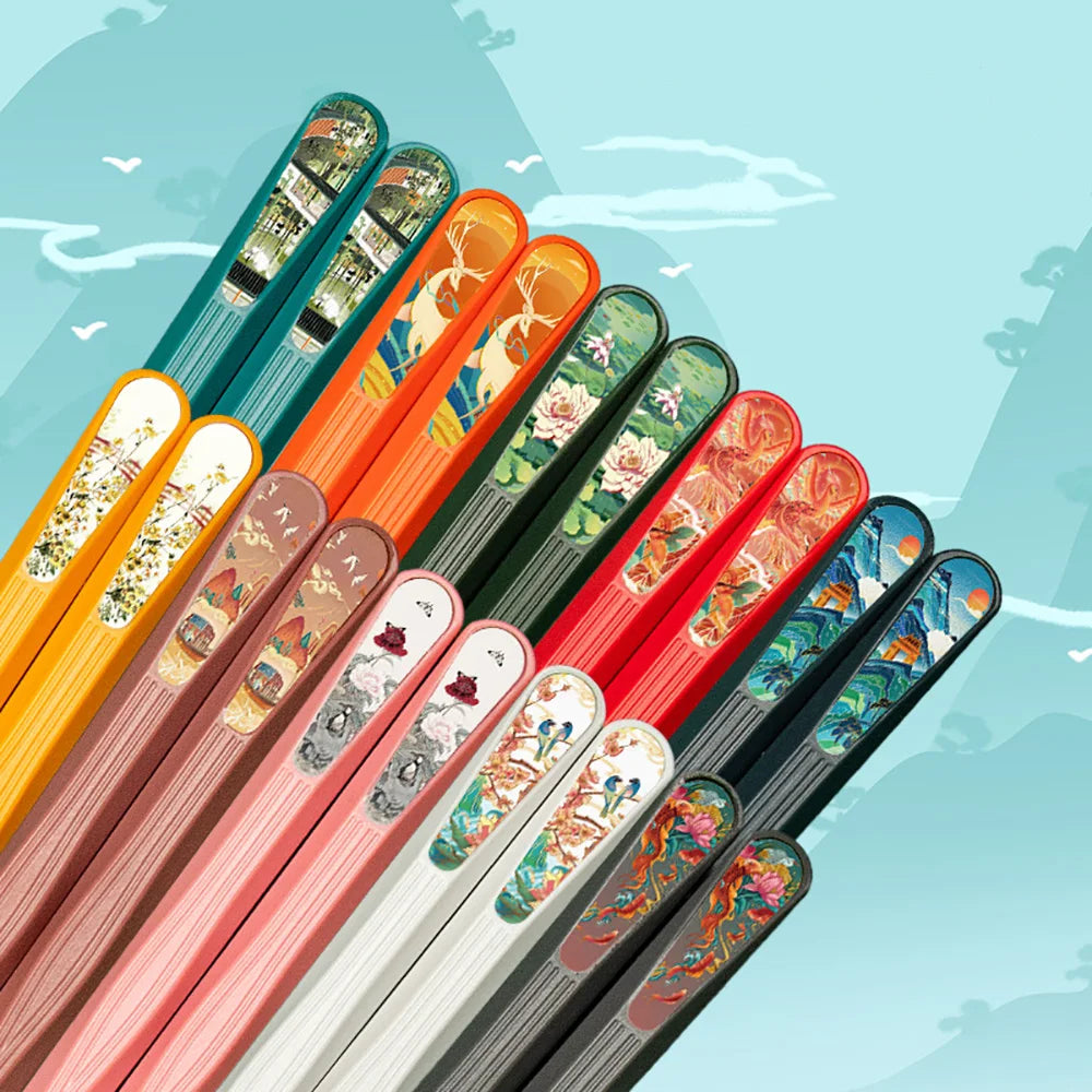 Set of kawaii colorful chopsticks with decorative handles on a light blue background