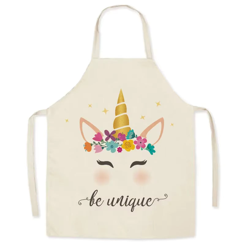 Beige kawaii apron with a unicorn design and 'be unique' text on a white background