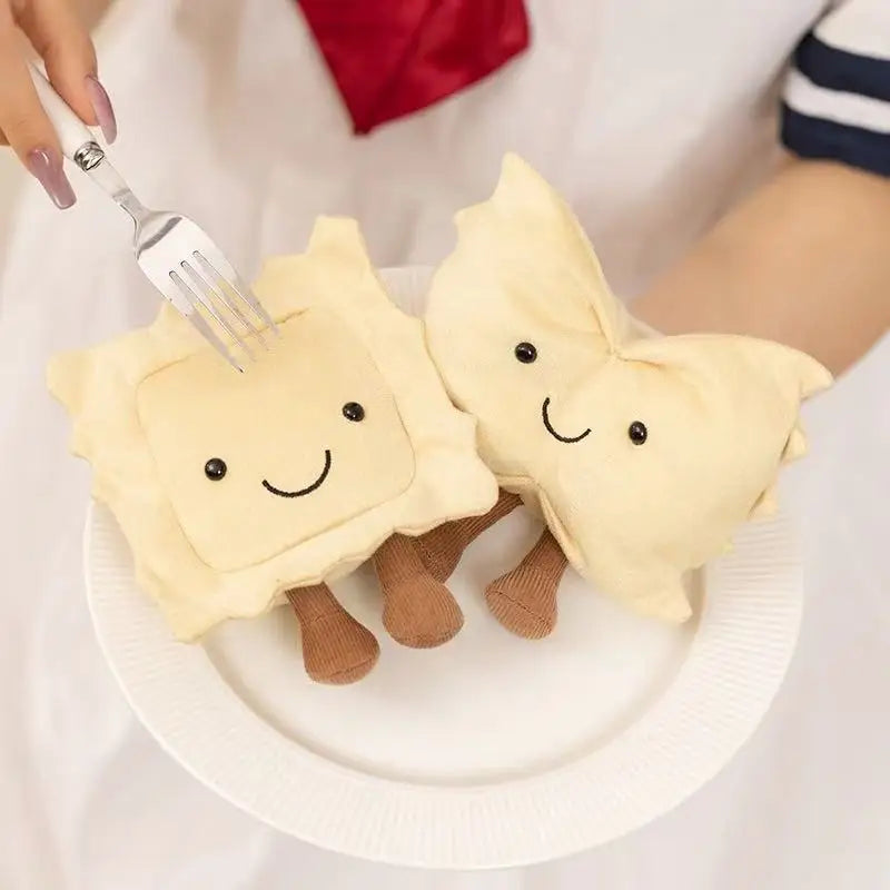 Two cute kawaii plush toys resembling toast with smiling faces on a white plate.