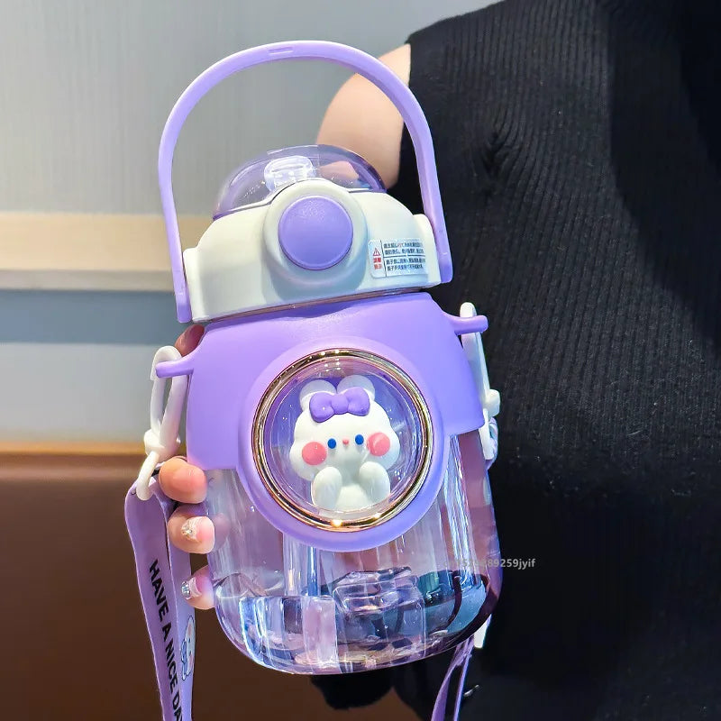 Purple children's kawaii water bottle with a cartoon character on a neutral background