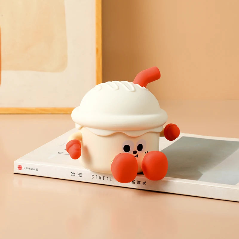 Cute cartoon kawaii night light with a white hat and red paws on a book