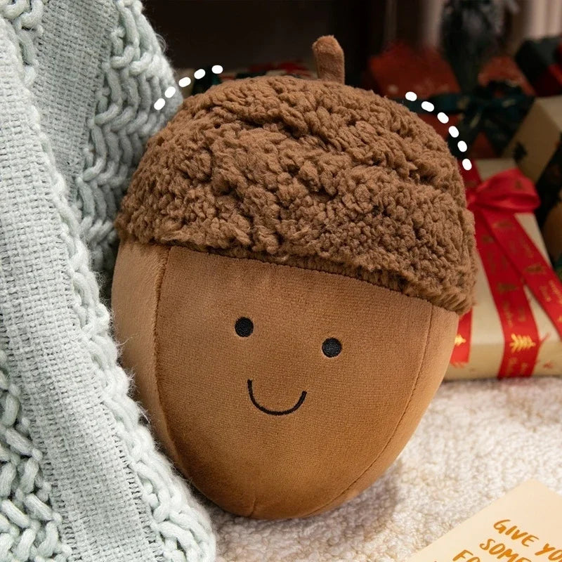 Kawaii plush acorn toy with a smiling face on a soft surface with a blurred background