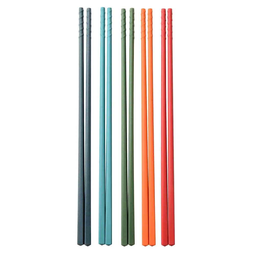 Set of colorful kawaii chopsticks in four different colors on a white background