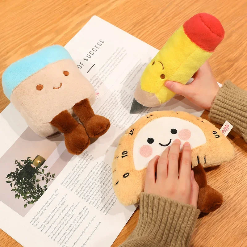 Three kawaii plush toys on a wooden surface with a magazine underneath