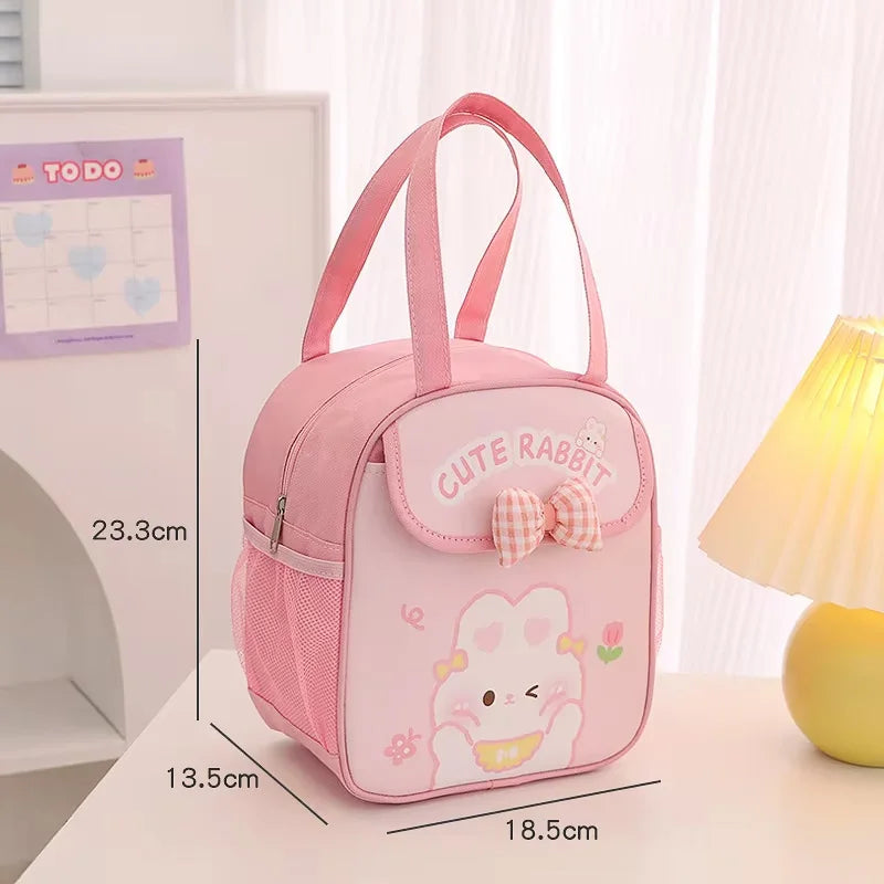 Pink 'Cute Rabbit' kawaii bag with measurements on a desk