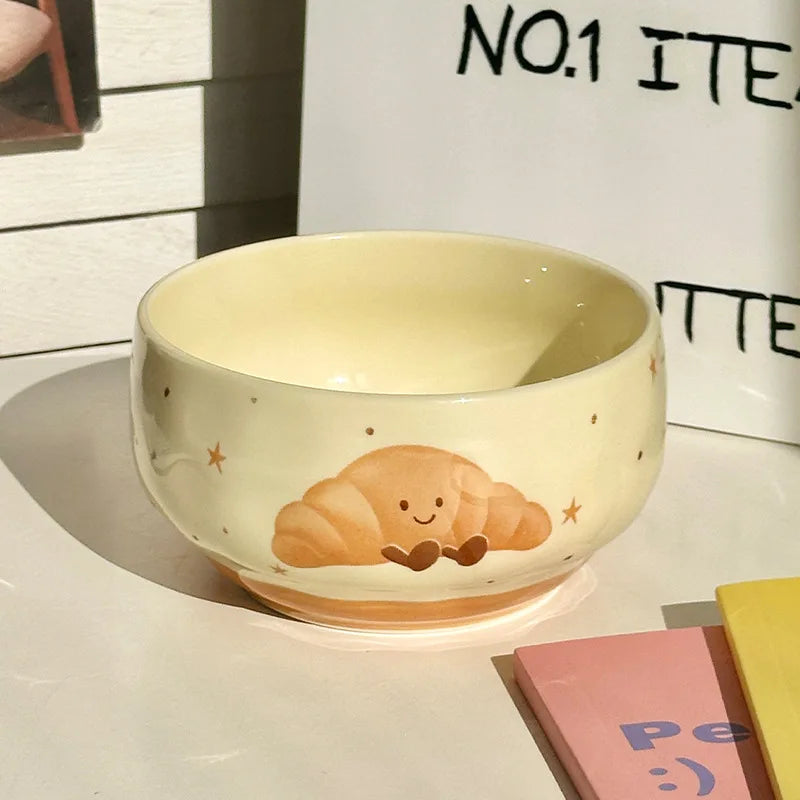A kawaii bowl with a croissant design on it