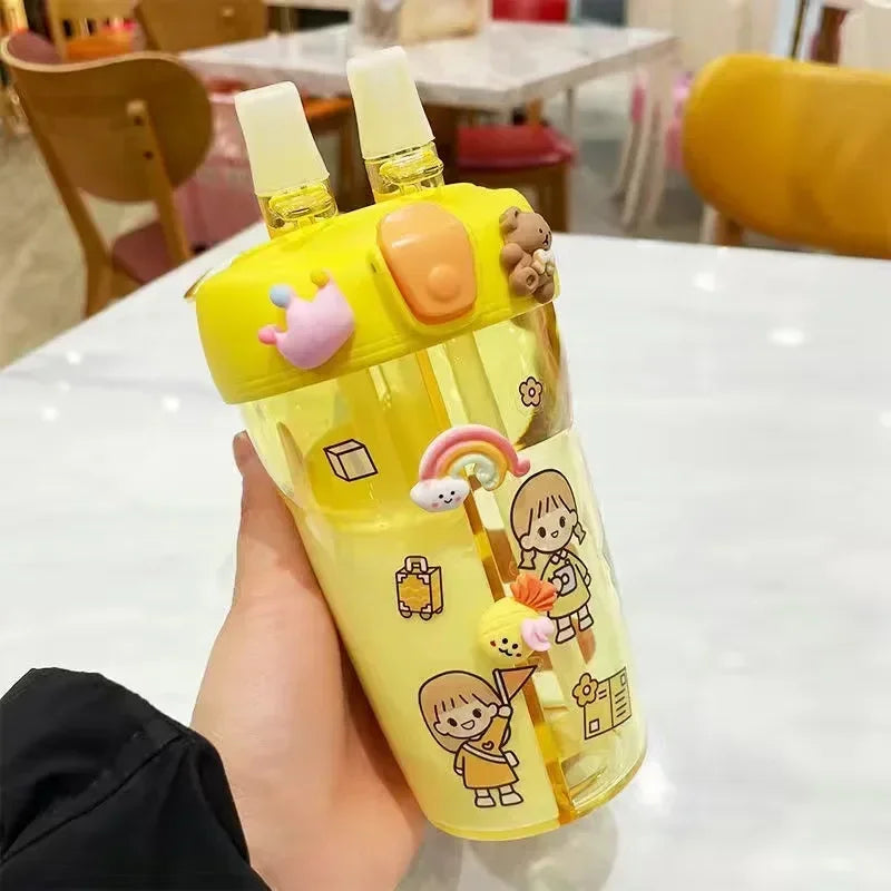 Yellow cartoon-themed kawaii water bottle held by a hand on a white surface with blurred background