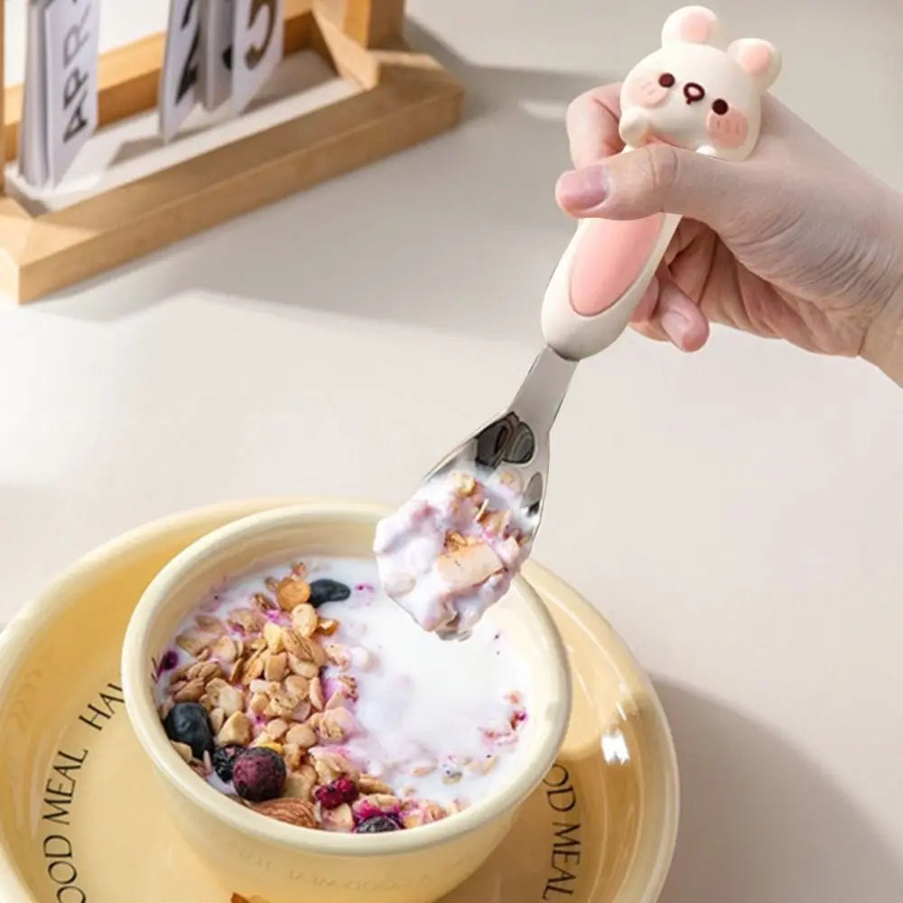 Someone eating oatmeal from a bowl with a kawaii spoon