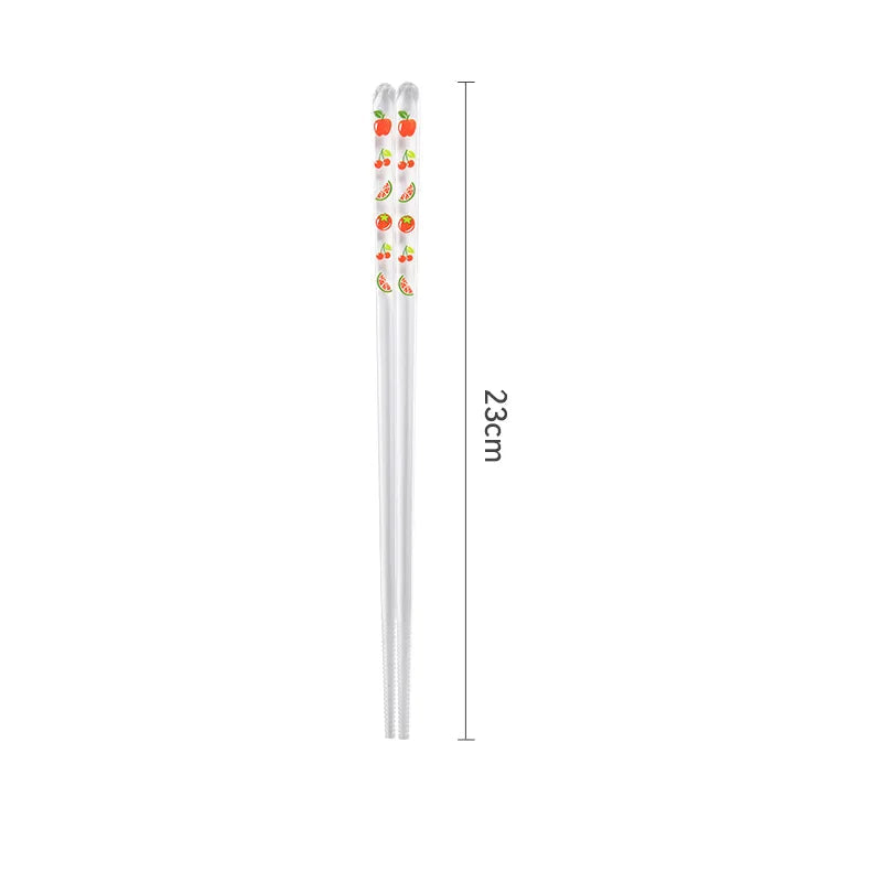Pair of kawaii chopsticks with fruit design on a white background