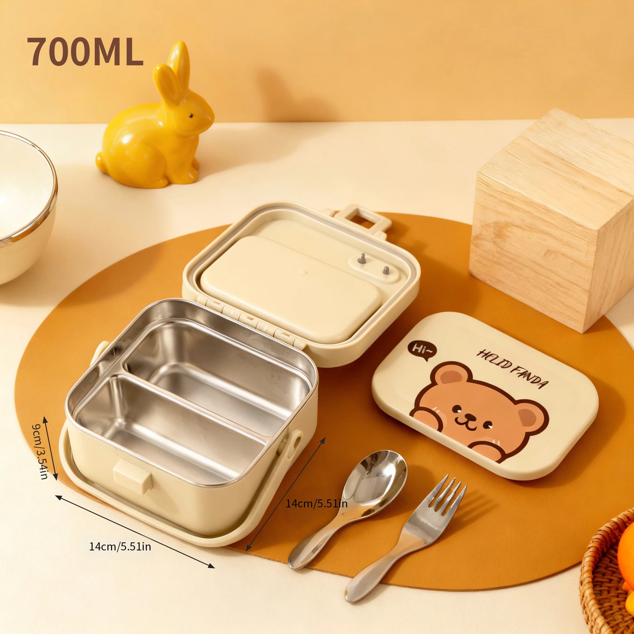 Stainless steel kawaii lunch box with bear design, spoon, and fork on a yellow background