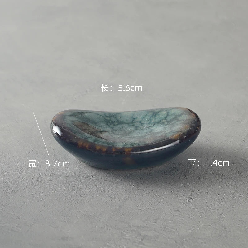 Decorative kawaii chopstick holder with measurements on a gray background