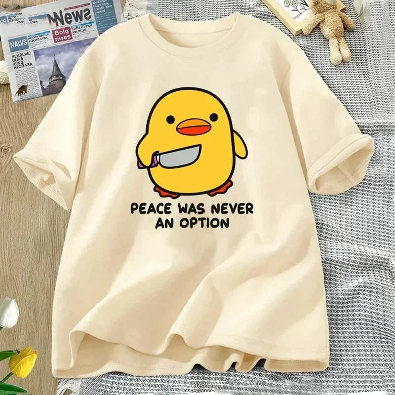 Beige t-shirt with a kawaii cartoon duck and text on a textured surface