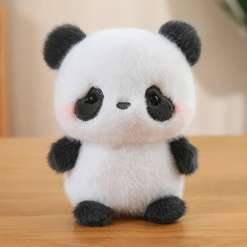 Cute plush panda kawaii toy on a wooden surface with a blurred background