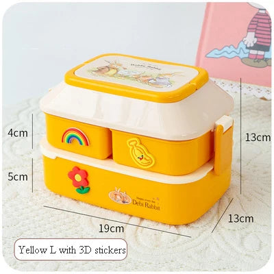Yellow kawaii lunch box with 3D stickers and measurements on a light gray background