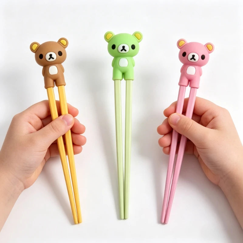 Three pairs of colorful bear-shaped kawaii chopsticks held by hands on a white background