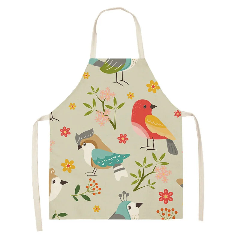 Children's kawaii apron with bird and floral pattern on a beige background