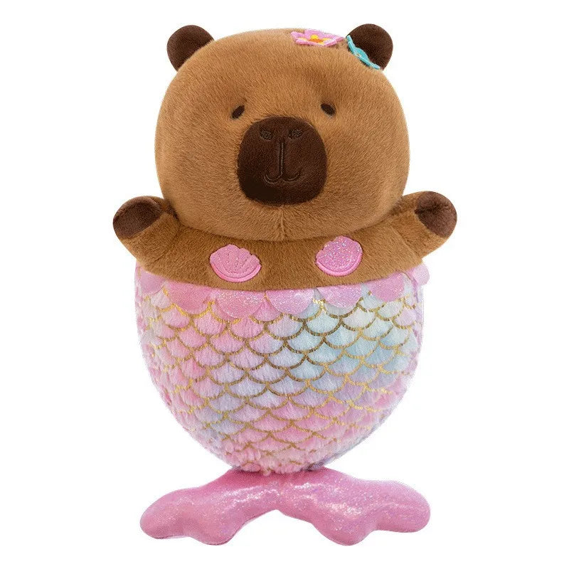 Capybara plush toy with mermaid tail on a white background