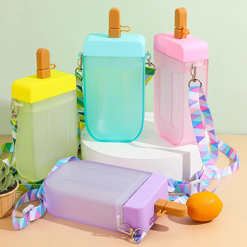 Colorful kawaii water bottle shaped like popsicles with lanyards on a light green background