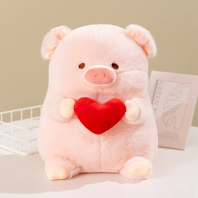 A pink kawaii pig plush toy holding a love heart
