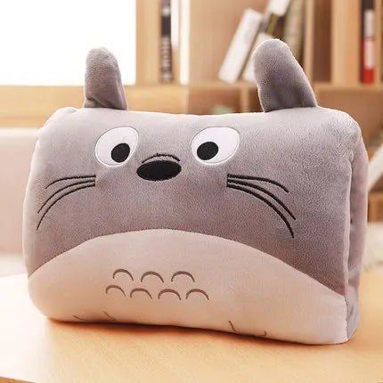 Plush kawaii pillow with cartoon face on a wooden surface