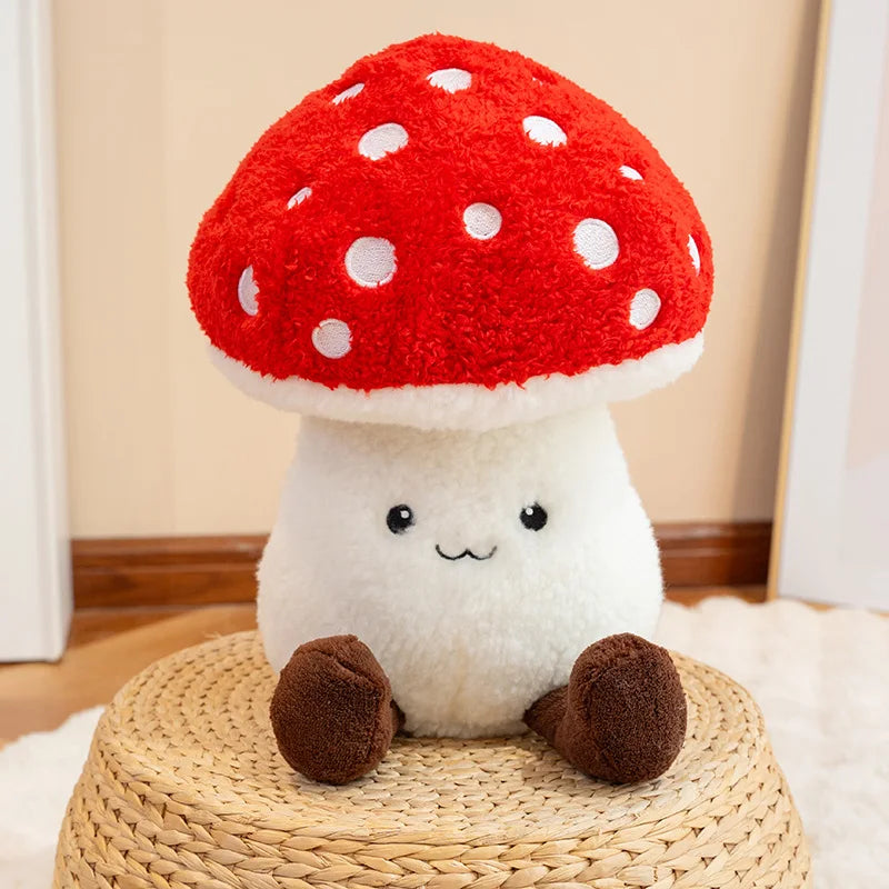 Cute kawaii plush mushroom toy with a red cap and white spots sitting on a woven stool.
