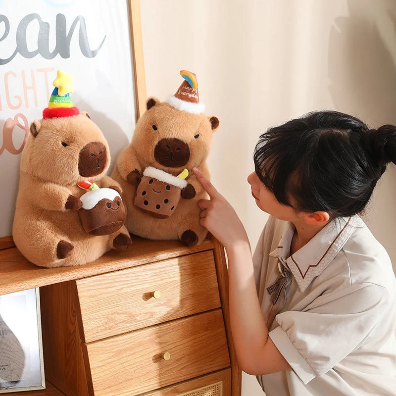 Person interacting with two capybara plush toys on a wooden shelf.