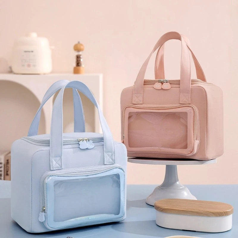 Two kawaii pet carriers, one blue and one pink, on a light background.