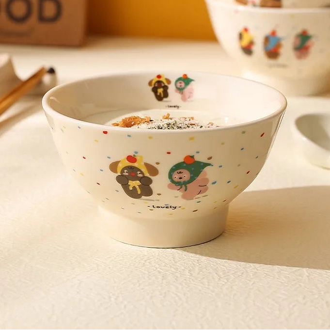 Ceramic kawaii ramen bowl with cartoon designs on a white surface, with text about heat resistance.
