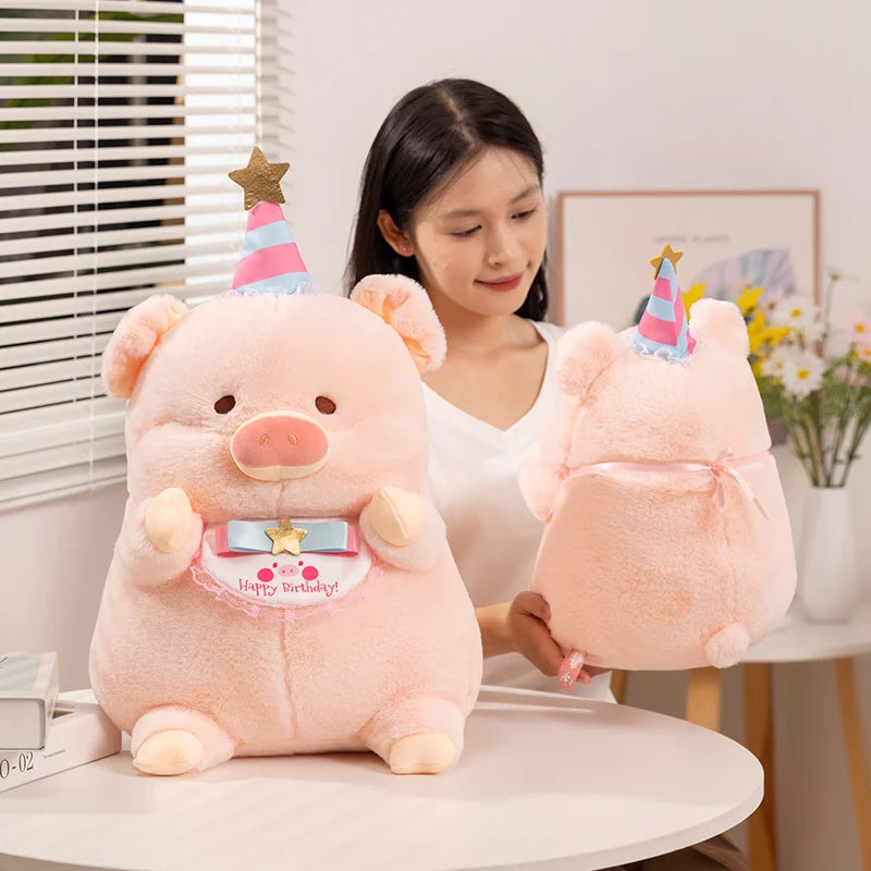 A woman holding a kawaii pig plush toy with a birthday hat on
