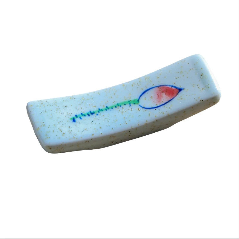 Kawaii chopstick holder with a fish design on a white background