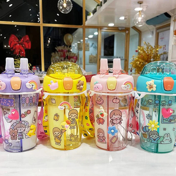 Four colorful children's kawaii cups with cartoon designs on a table.