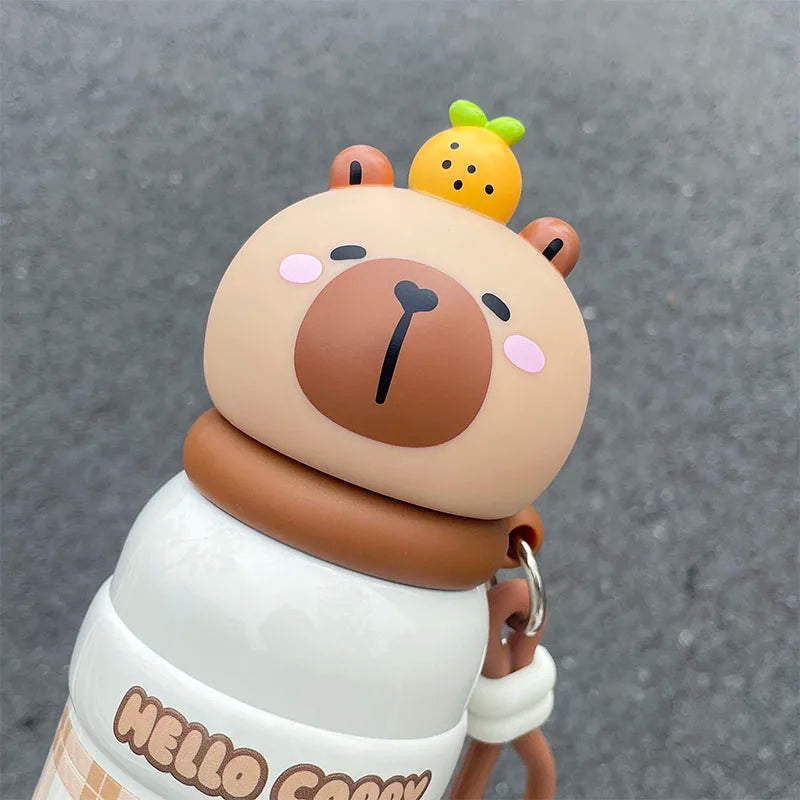 Cute kawaii water bottle cartoon bear figurine with a small yellow creature on its head, wearing a white shirt with 'Hello Cocom' text.
