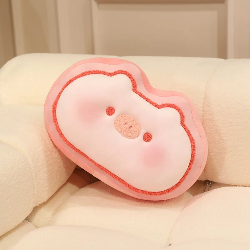 pig-shaped pink kawaii cushion with a face on a beige background