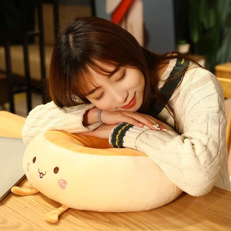 Woman hugging a kawaii plush toy resembling a cartoon character on a wooden floor.
