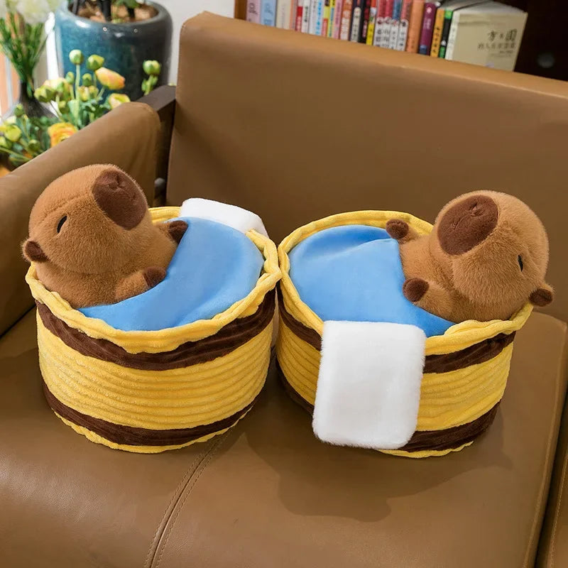 Two kawaii plush animal slippers with yellow baskets on a brown couch.