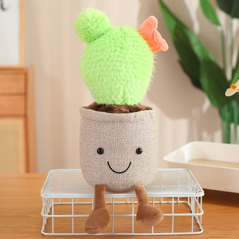 Plush kawaii toy cactus in a pot with a face on a small stand