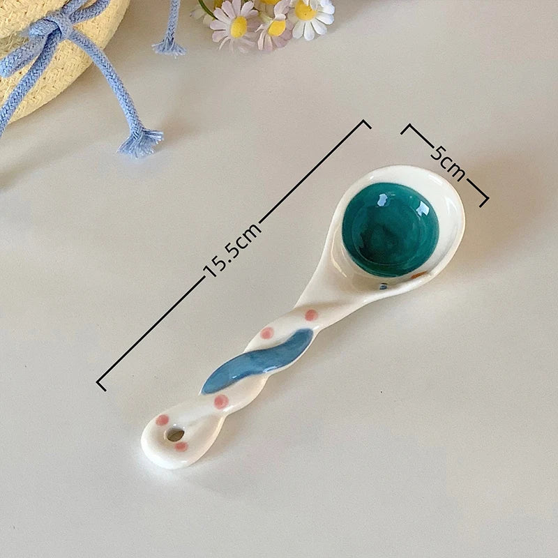 A white ceramic kawaii spoon on a table