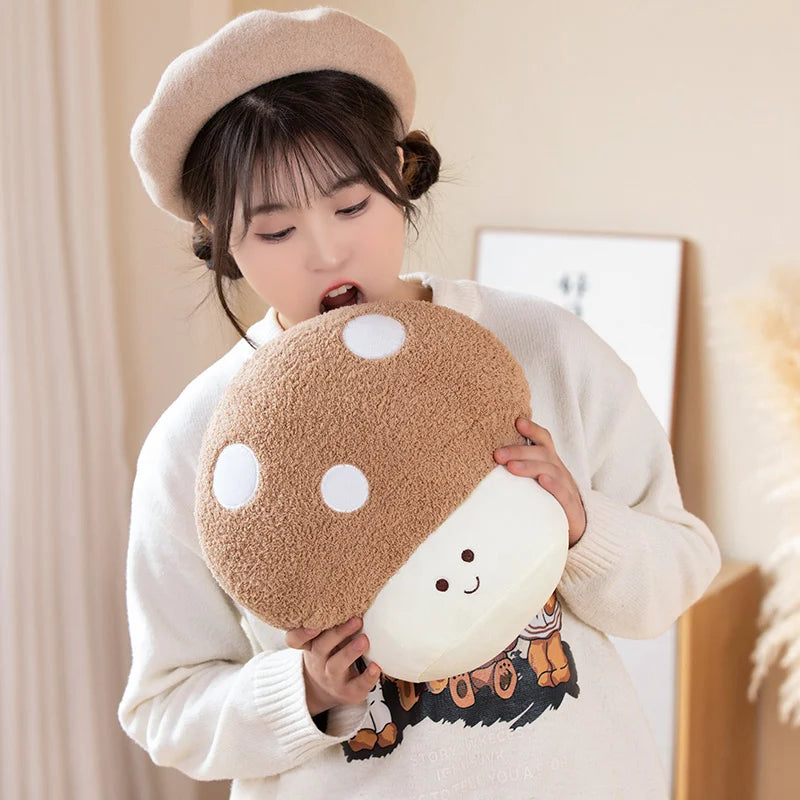Person holding a kawaii plush mushroom toy with a smiley face
