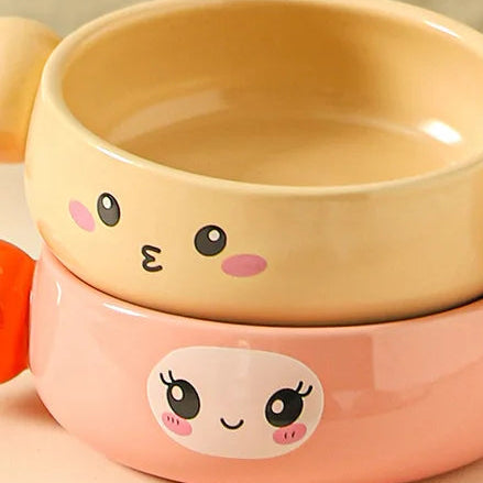 Two cartoon-style ceramic kawaii ramen bowls with cute faces on a beige background.