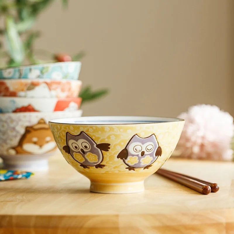 A kawaii bowl with a bird design sitting on a table