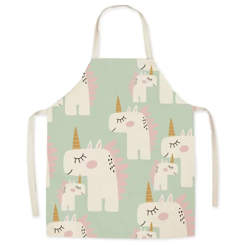 Children's kawaii apron with unicorn pattern on a light green background