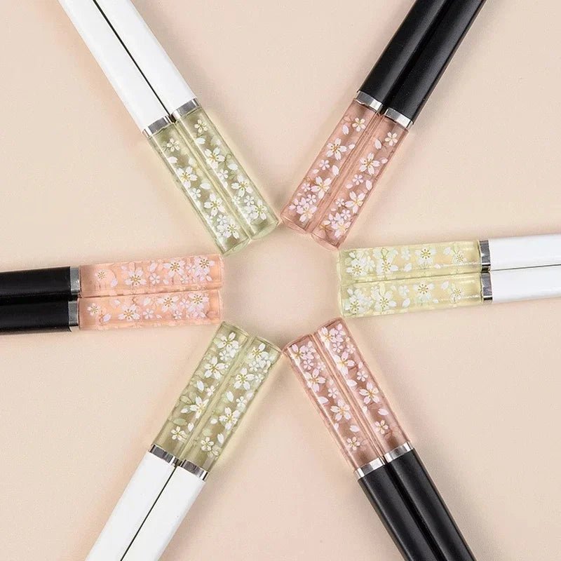 Set of kawaii chopsticks with floral designs on a beige background