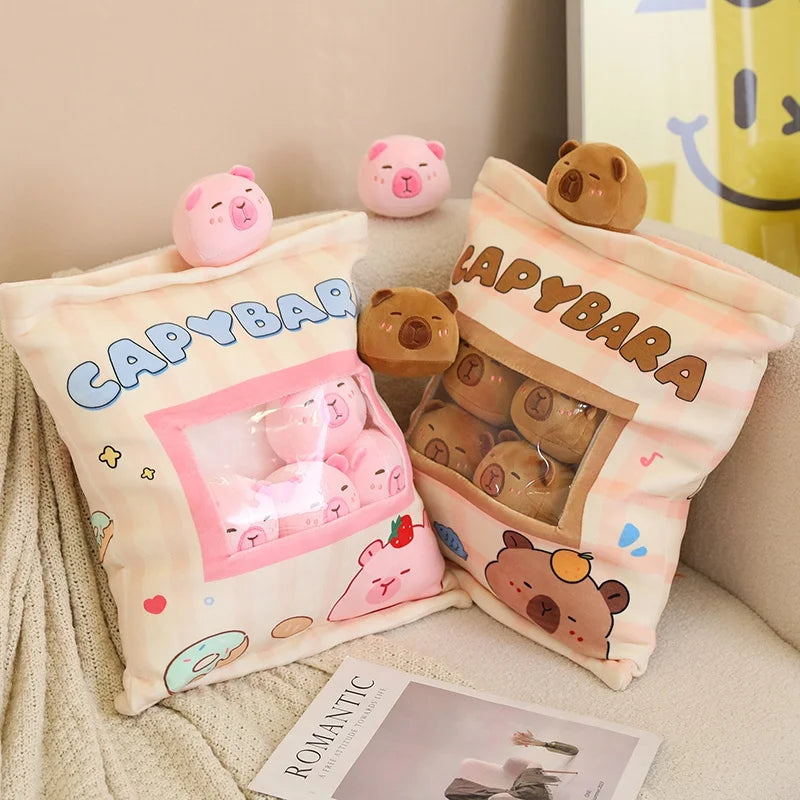 Capybara-themed kawaii pillows and plush toys on a couch with a magazine underneath.