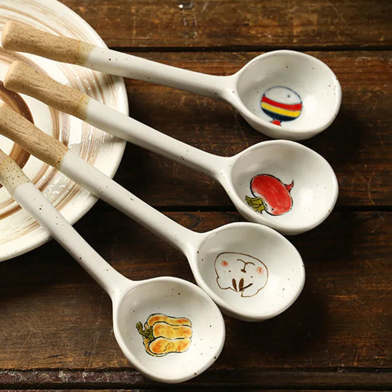 Four kawaii spoons of different designs on the kitchen table