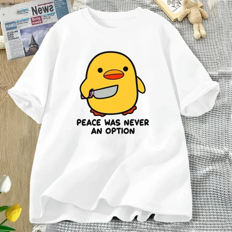 White t-shirt with a yellow kawaii duck graphic and text on a textured surface.