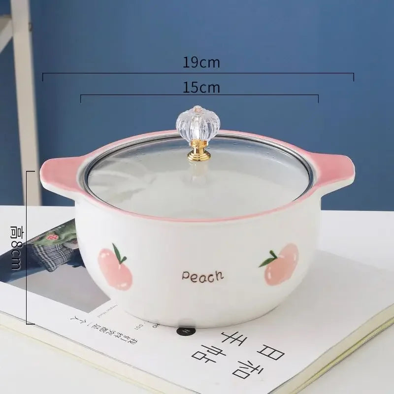 A peach designed kawaii ramen bowl on a table