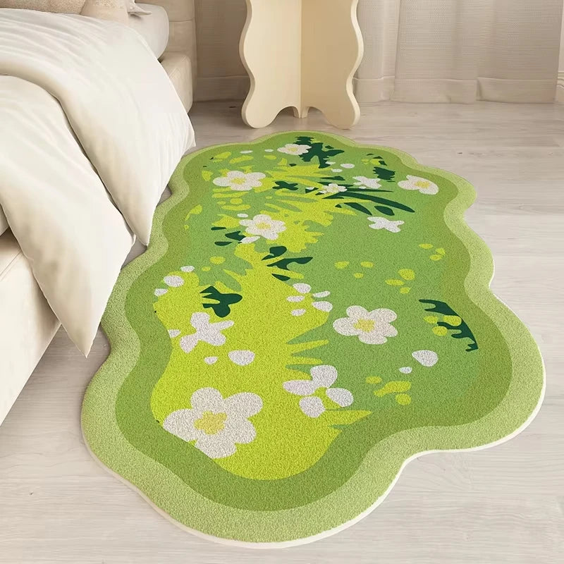 Green floral kawaii rug on a wooden floor in a room with a bed and nightstand.